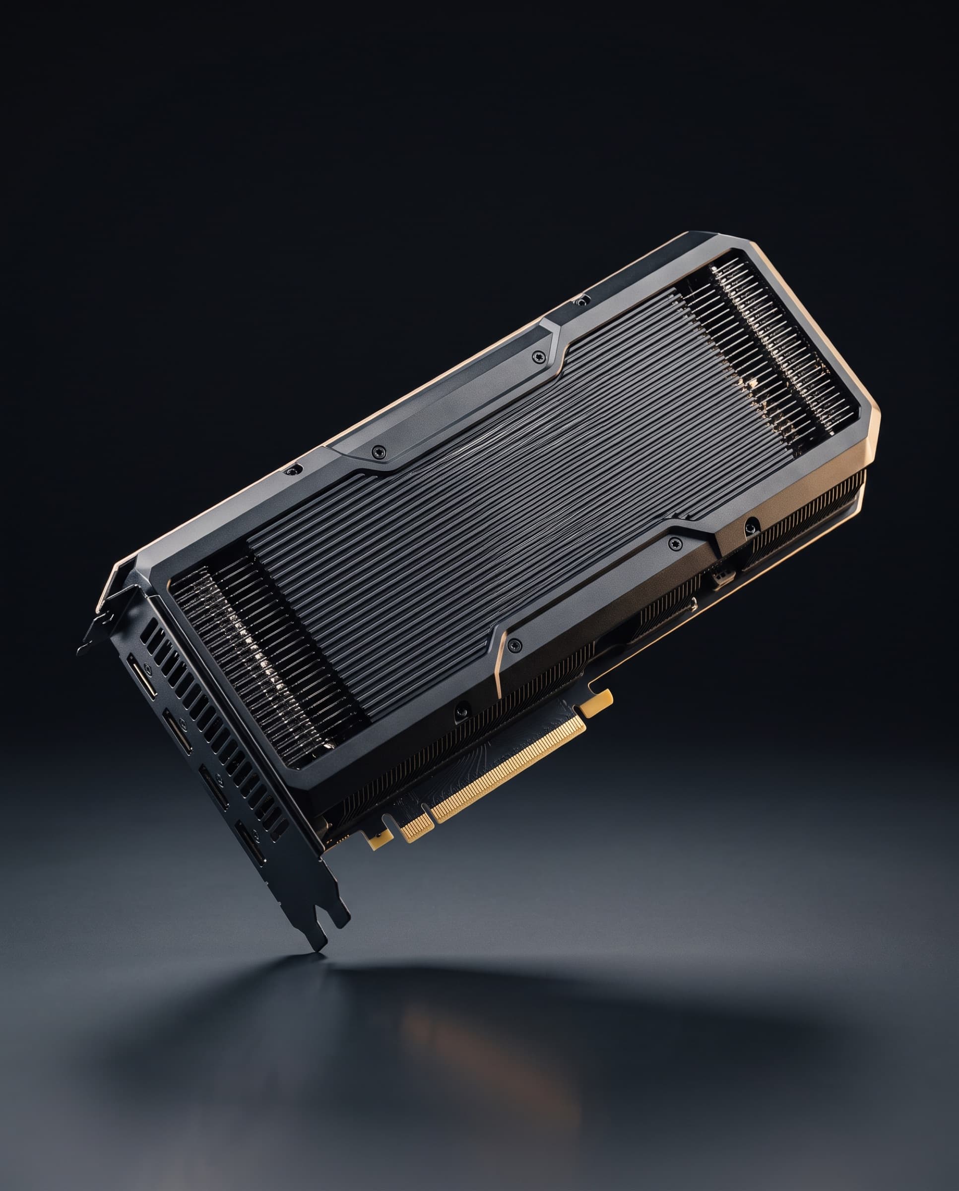 A passively cooled datacentre GPU card floating above a dark surface